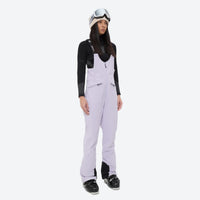 
                  
                    Women's fur trim hood snow jacket with suspender bibs - lavender bib pants, for resort and cross-country days
                  
                
