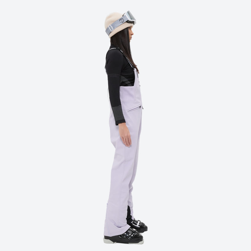 Women's 3-layer breathable ski suit set - lavender bib pants, on-model side view, for cold-weather winter sports