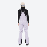 
                  
                    Women's waterproof 3L ski jacket and bib pants series - lavender bib pants, on-model back view, for snowy mountain travel
                  
                