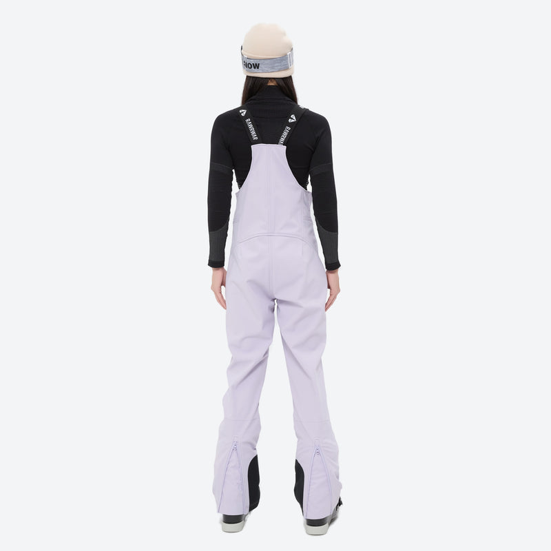 Women's waterproof 3L ski jacket and bib pants series - lavender bib pants, on-model back view, for snowy mountain travel