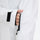 Women's 3-layer breathable ski suit set - white, cuff strap close-up with hand, for snowy mountain travel
