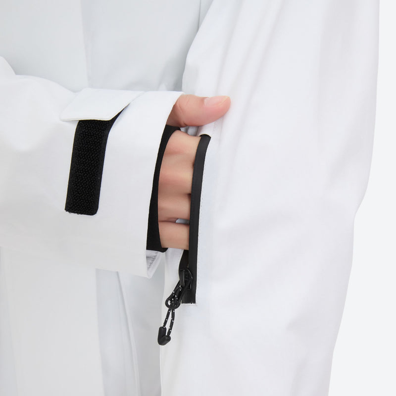 Women's 3-layer breathable ski suit set - white, cuff strap close-up with hand, for snowy mountain travel