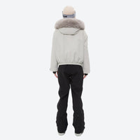 
                  
                    Women's 3-layer breathable ski suit set - white fur trim hood jacket with black bib pants, for snowy mountain travel
                  
                
