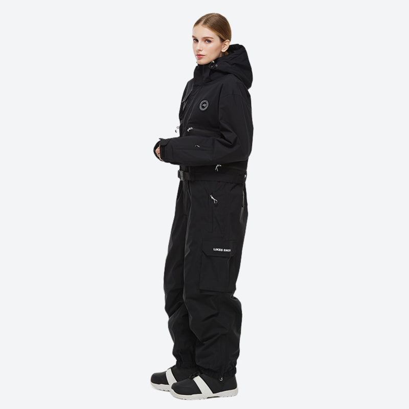 Unisex waterproof 2L one-piece snow suit - black one-piece suit, on-model side view, for powder days and winter commute